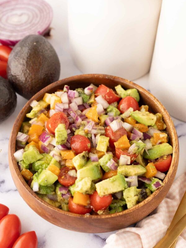 wooden bowl with avocado salad