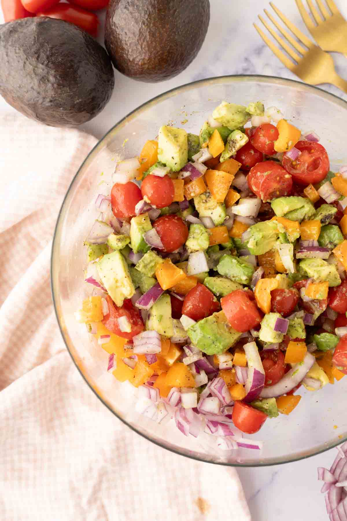 avocado salad recipe in a clear bowl