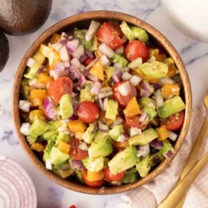 wooden bowl with avocado salad recipe
