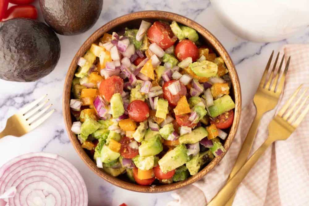 wooden bowl with avocado salad recipe