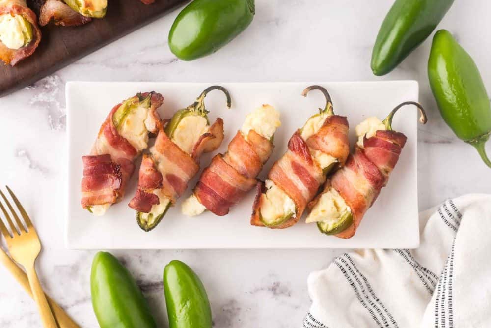 rectangle plate with baked bacon wrapped jalapeno poppers