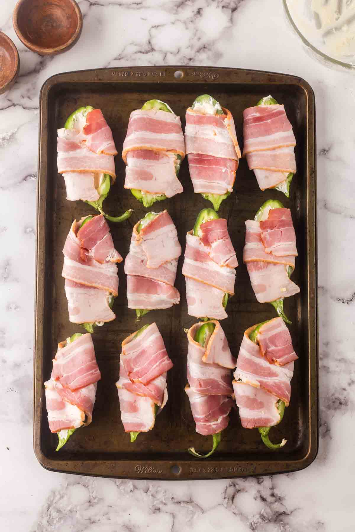 raw bacon wrapped jalapeno poppers