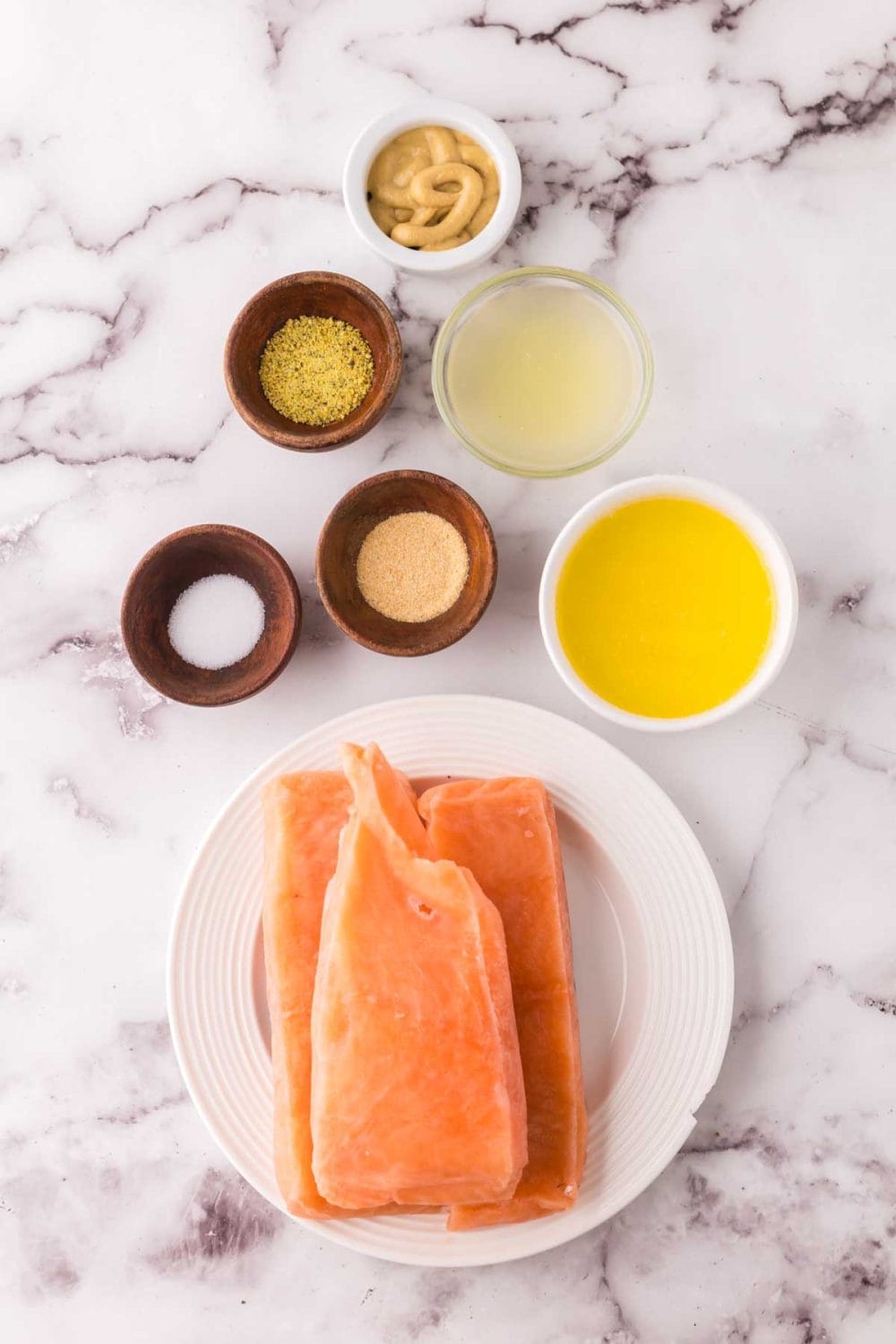 small portioned ingredients of baked salmon in foil recipe