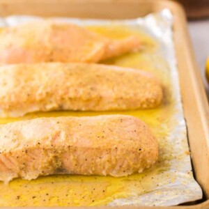 baked salmon over tin foil on a baking sheet.