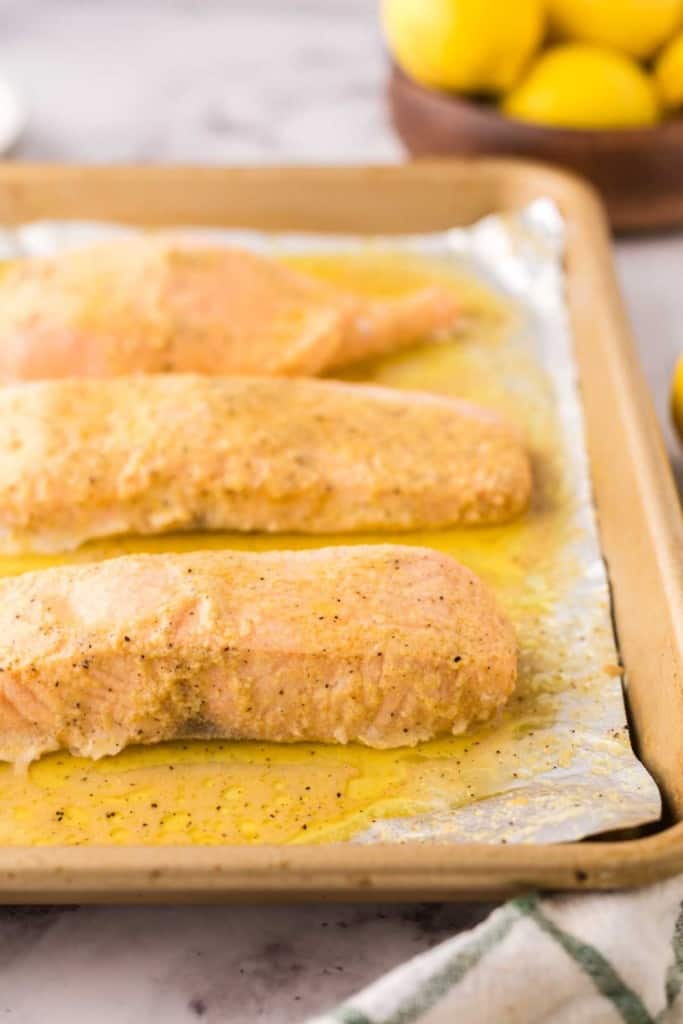 baked salmon over tin foil on a baking sheet.