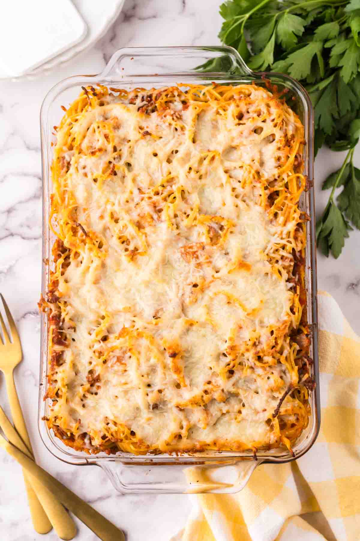 Casserole dish of baked spaghetti.