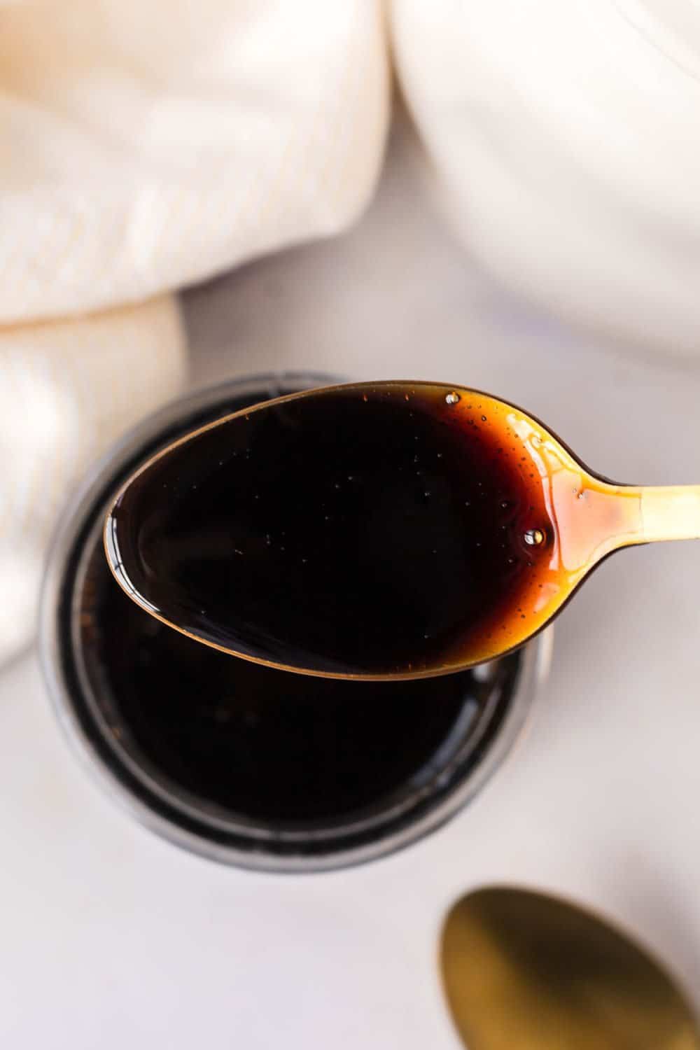 top view of a spoonful full of balsamic glaze