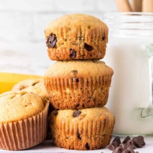 small stack of three banana chocolate chip muffins