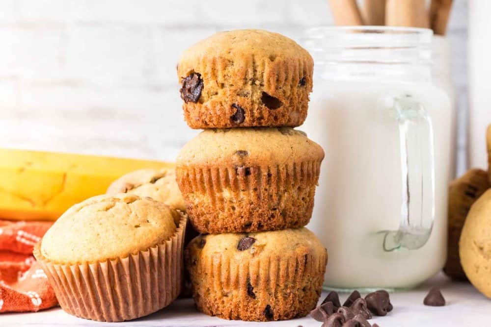 small stack of three banana chocolate chip muffins