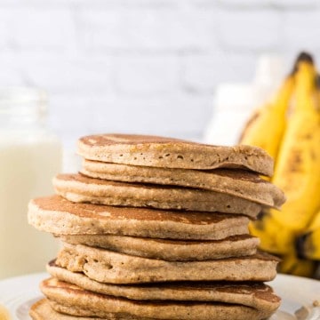 side view of a stack of banana oatmeal pancakes