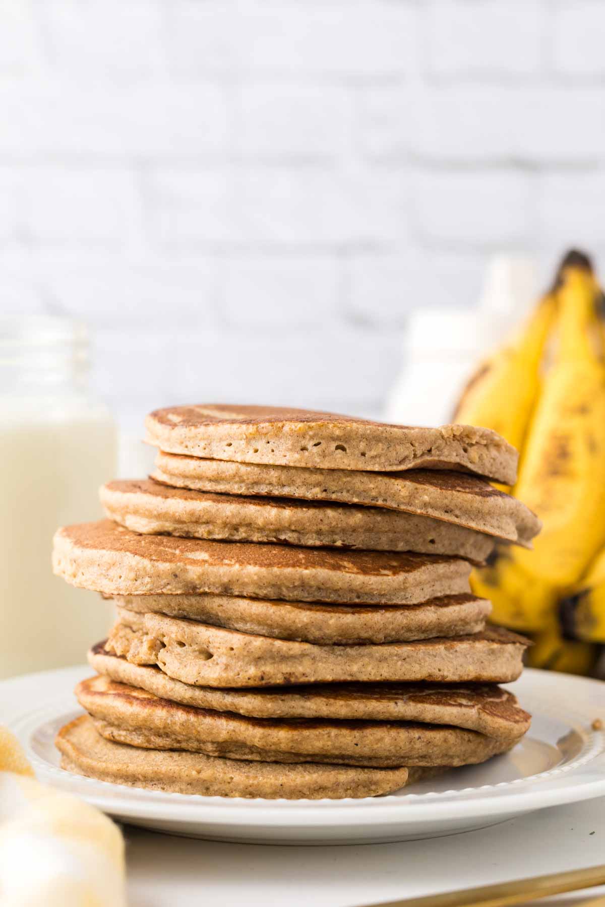 side view of a stack of banana oatmeal pancakes