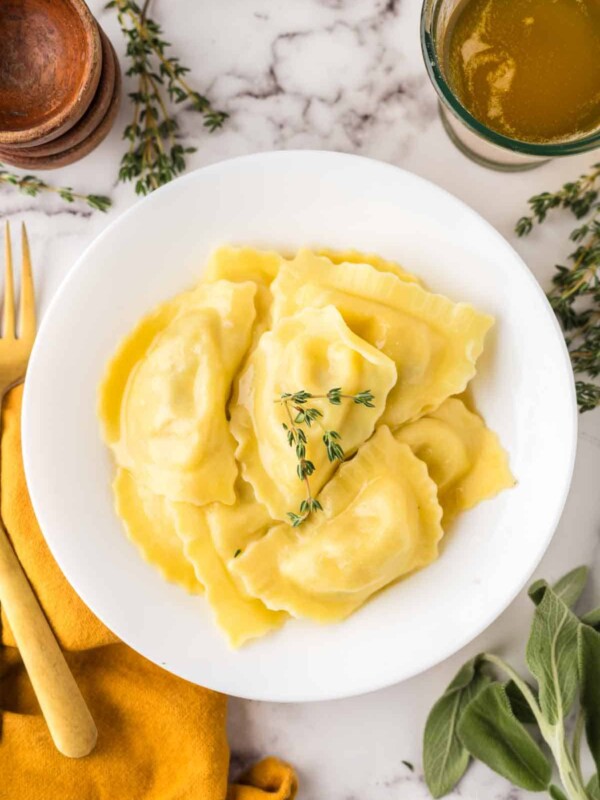 top view of round white plate with homemade ravioli