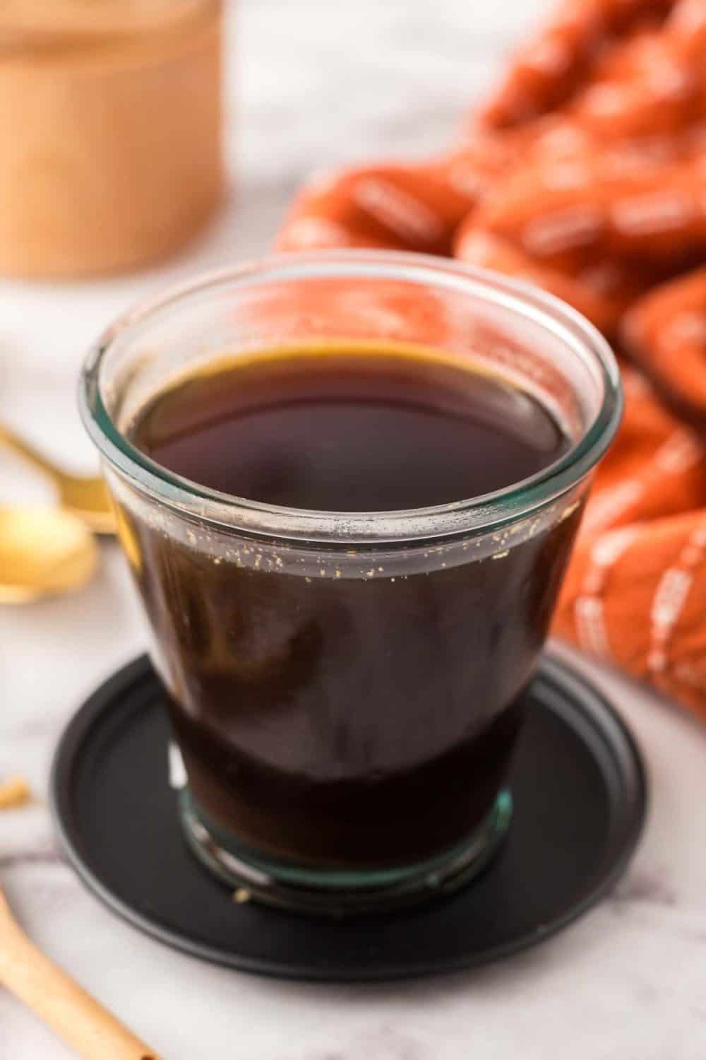 Brown sugar syrup in a small glass jar.