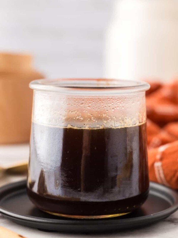 Brown sugar syrup in a small glass jar.
