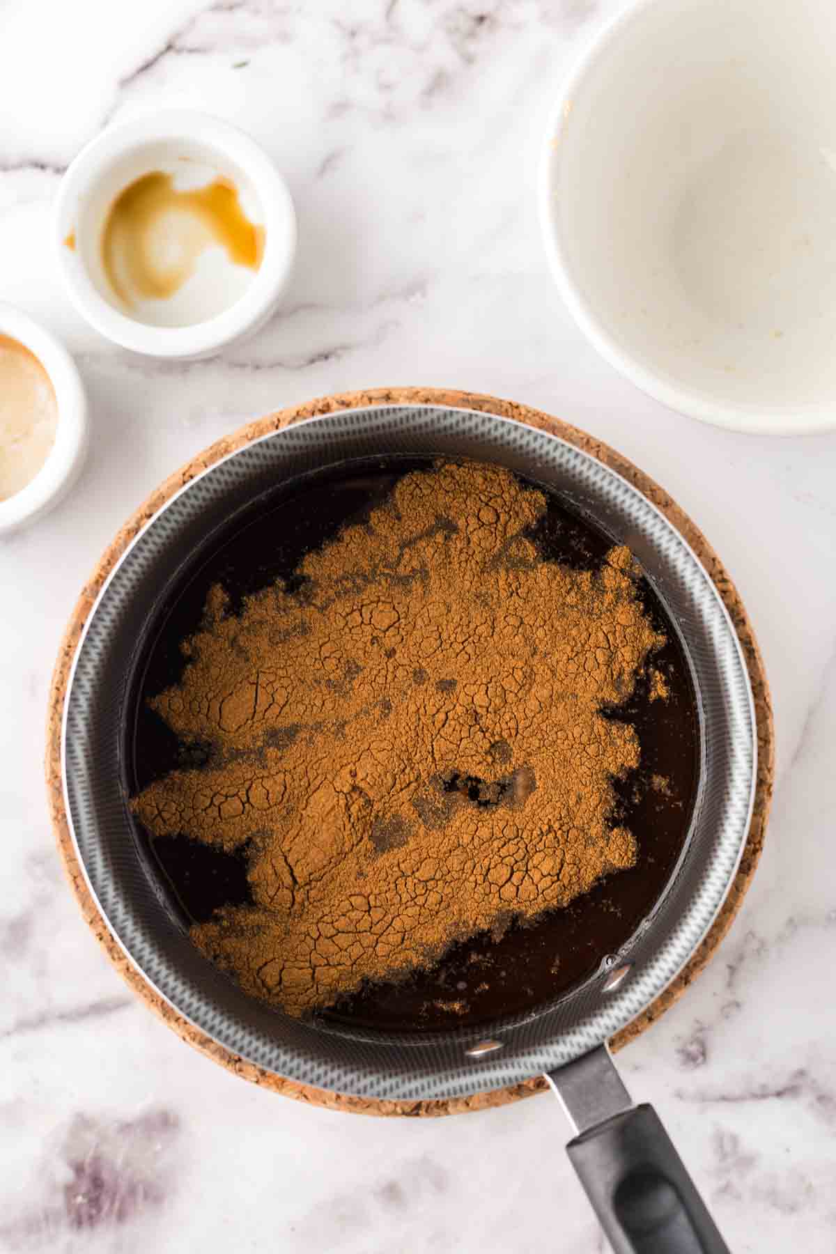 Brown sugar syrup in progress in a sauce pan.