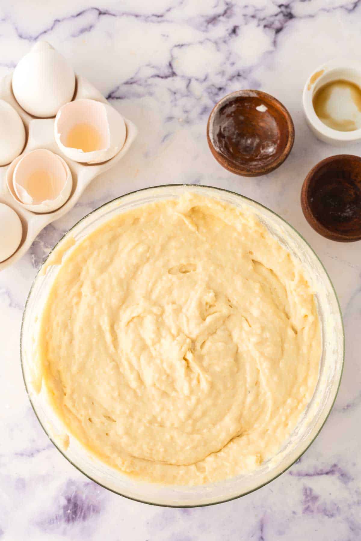 clear mixing bowl with ingredients to make buttermilk waffle butter in stages