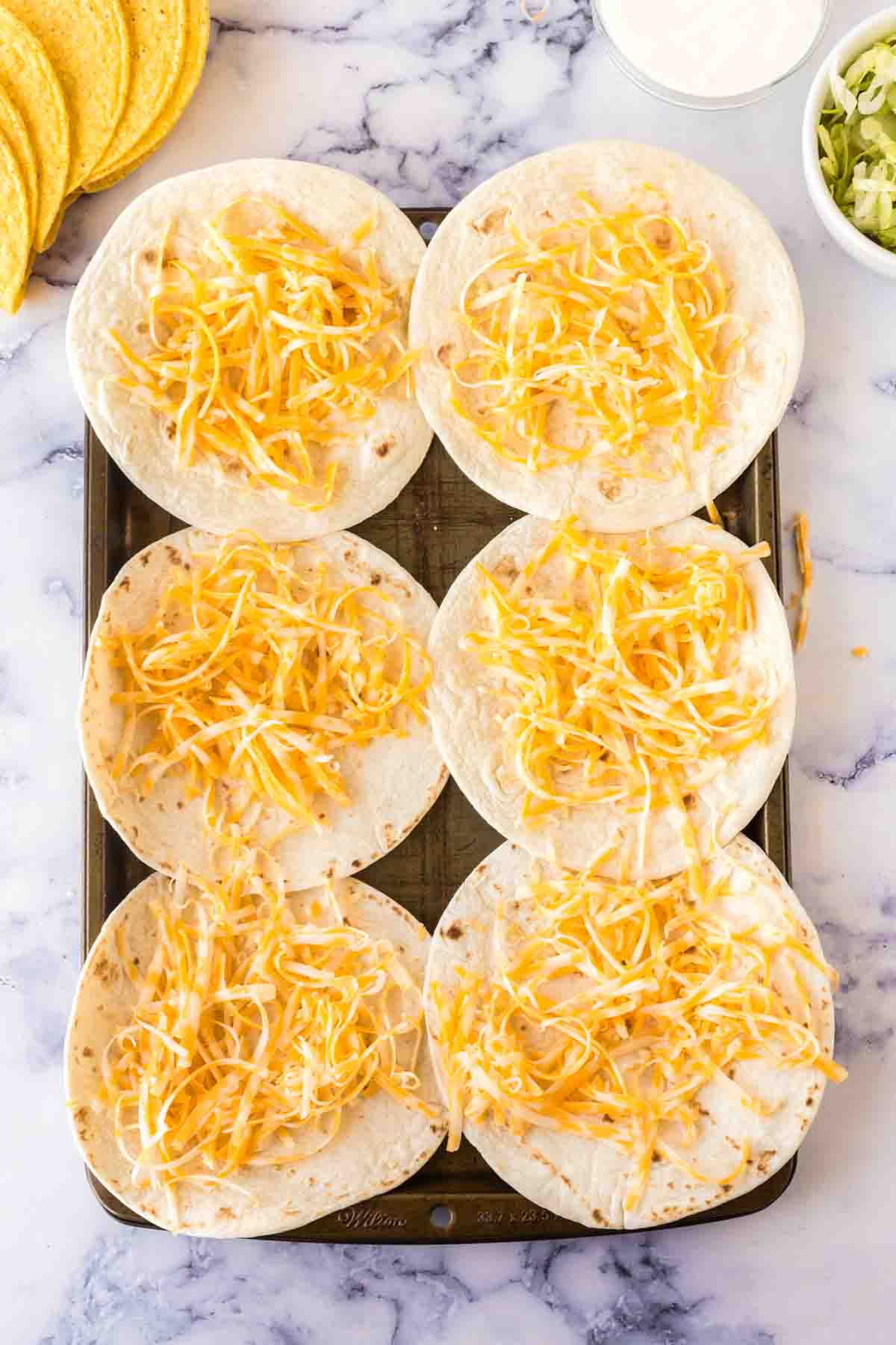 flour tortilla shells with cheese on top for cheesy gordita crunch recipe