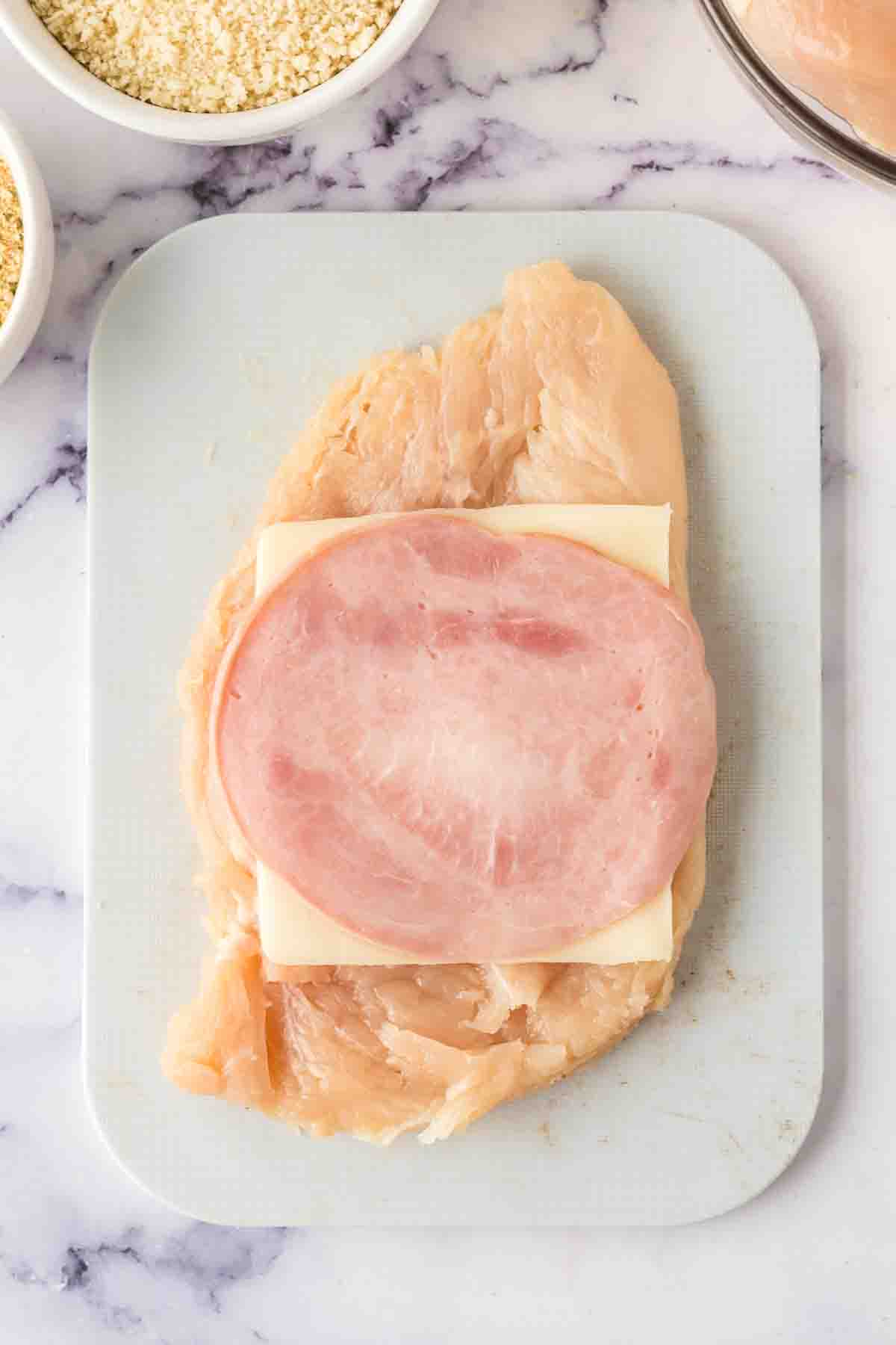 portioned raw ingredients for chicken cordon bleu recipe