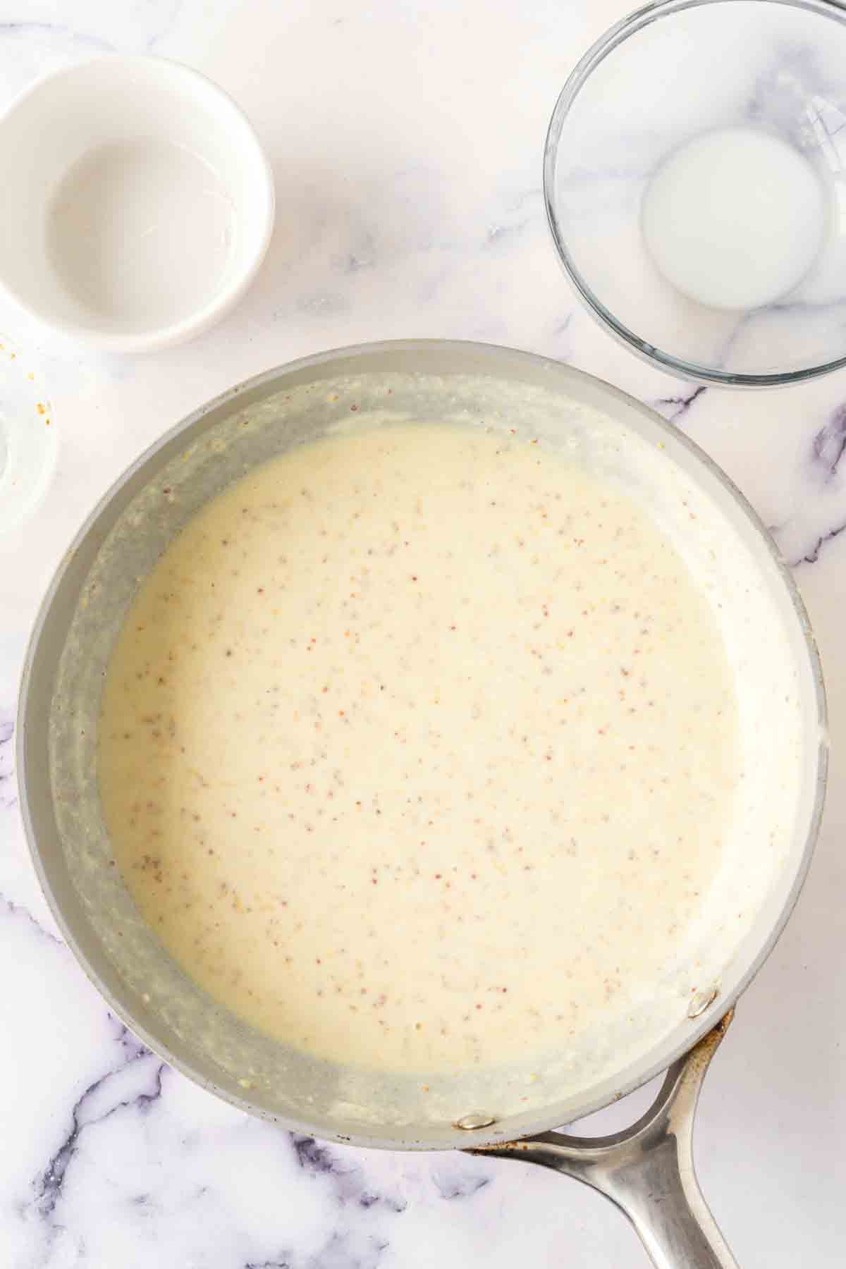 chicken cordon bleu sauce in a pan