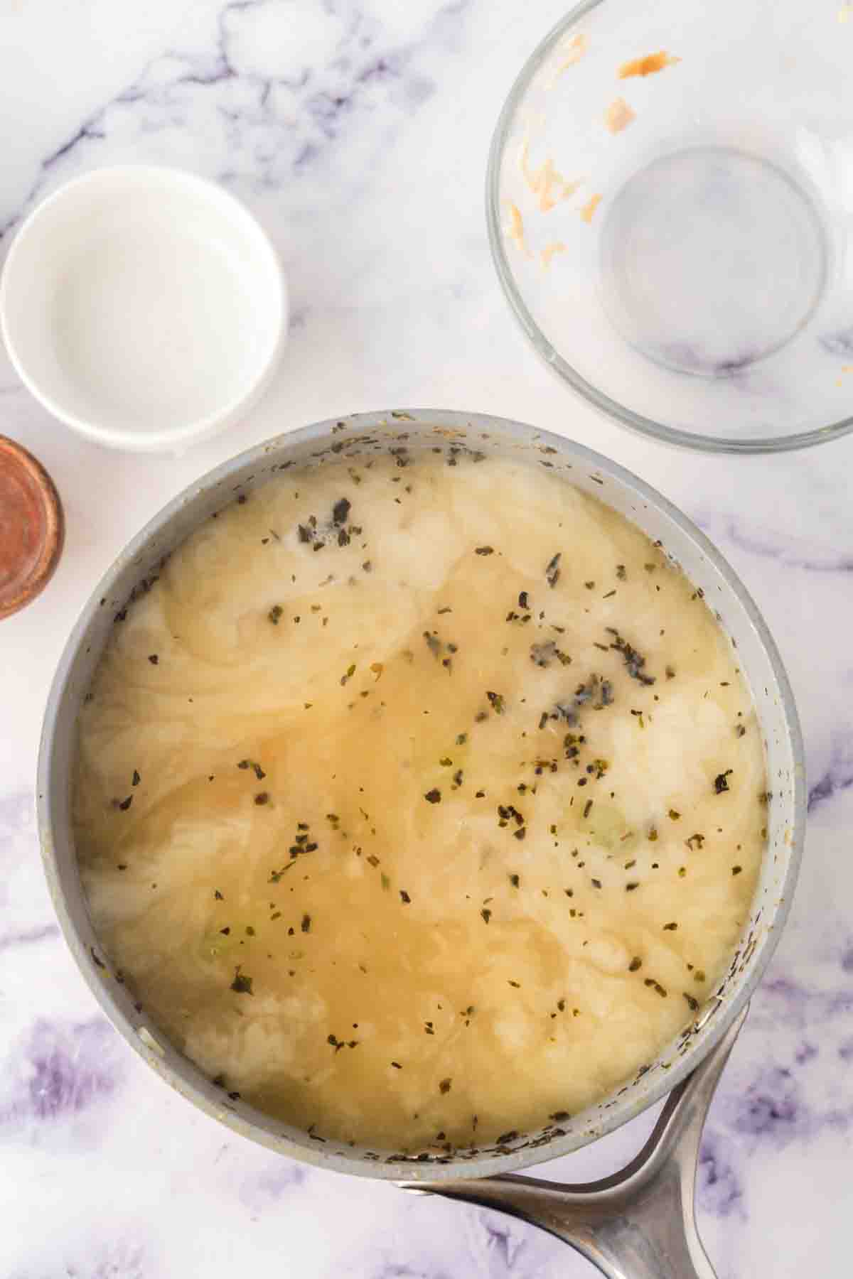 pot with chicken gnocchi soup ingredients