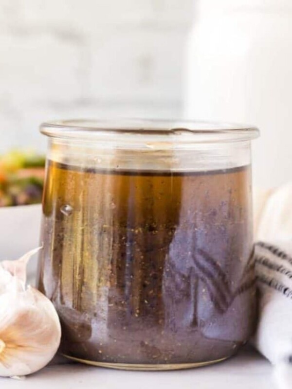 small glass jar with balsamic vinaigrette.