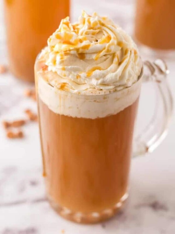delicious butterbeer served in a glass mug topped with whipped cream