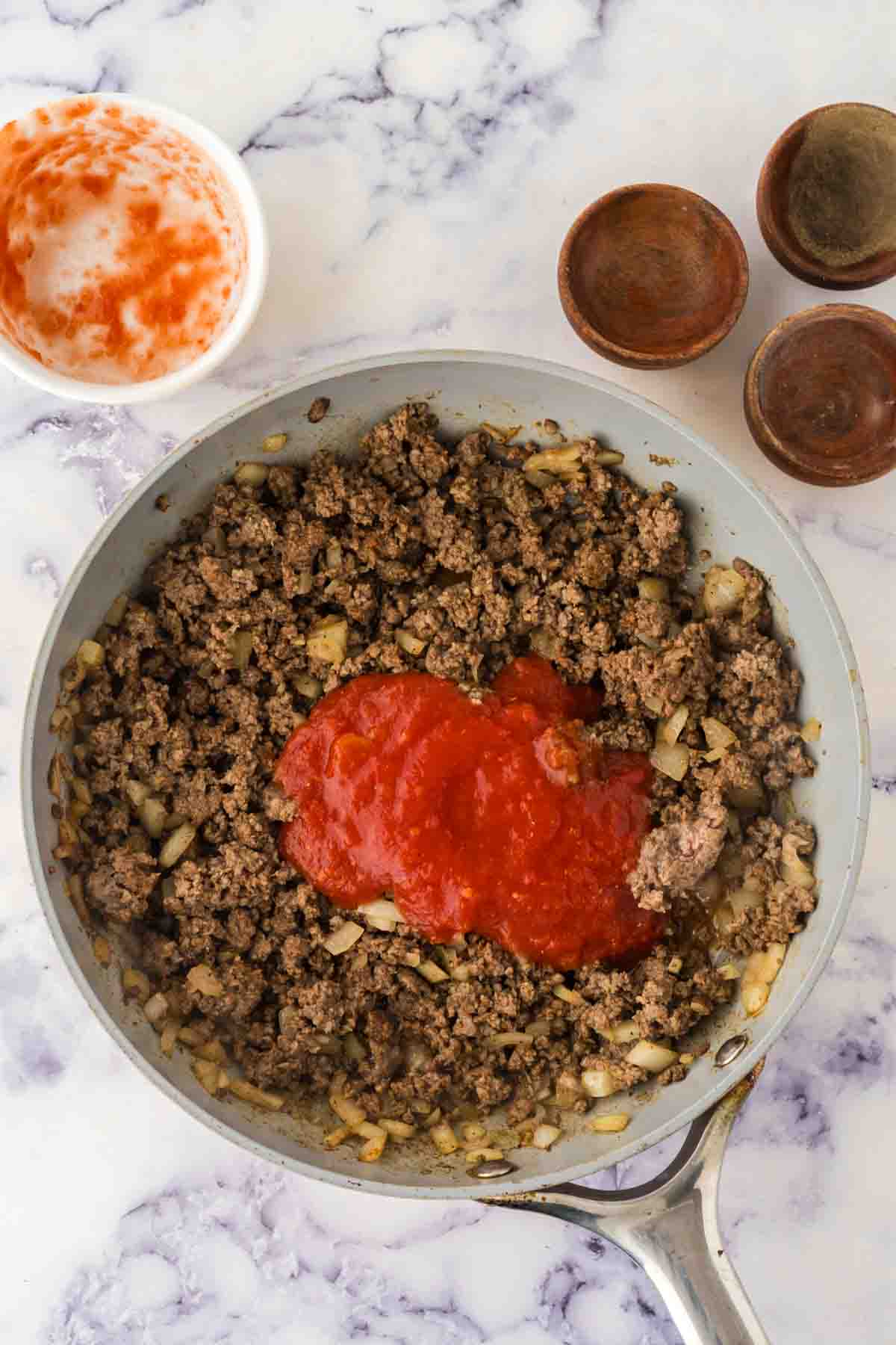 cooked burger meat in a pan for the hot dog chili recipe