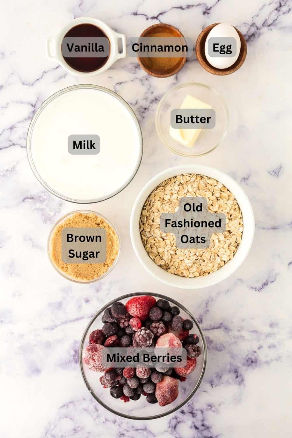 top view of digitally labeled portion dishes of raw ingredients for the baked oatmeal recipe