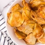 air fried potato chips in a white bowl.