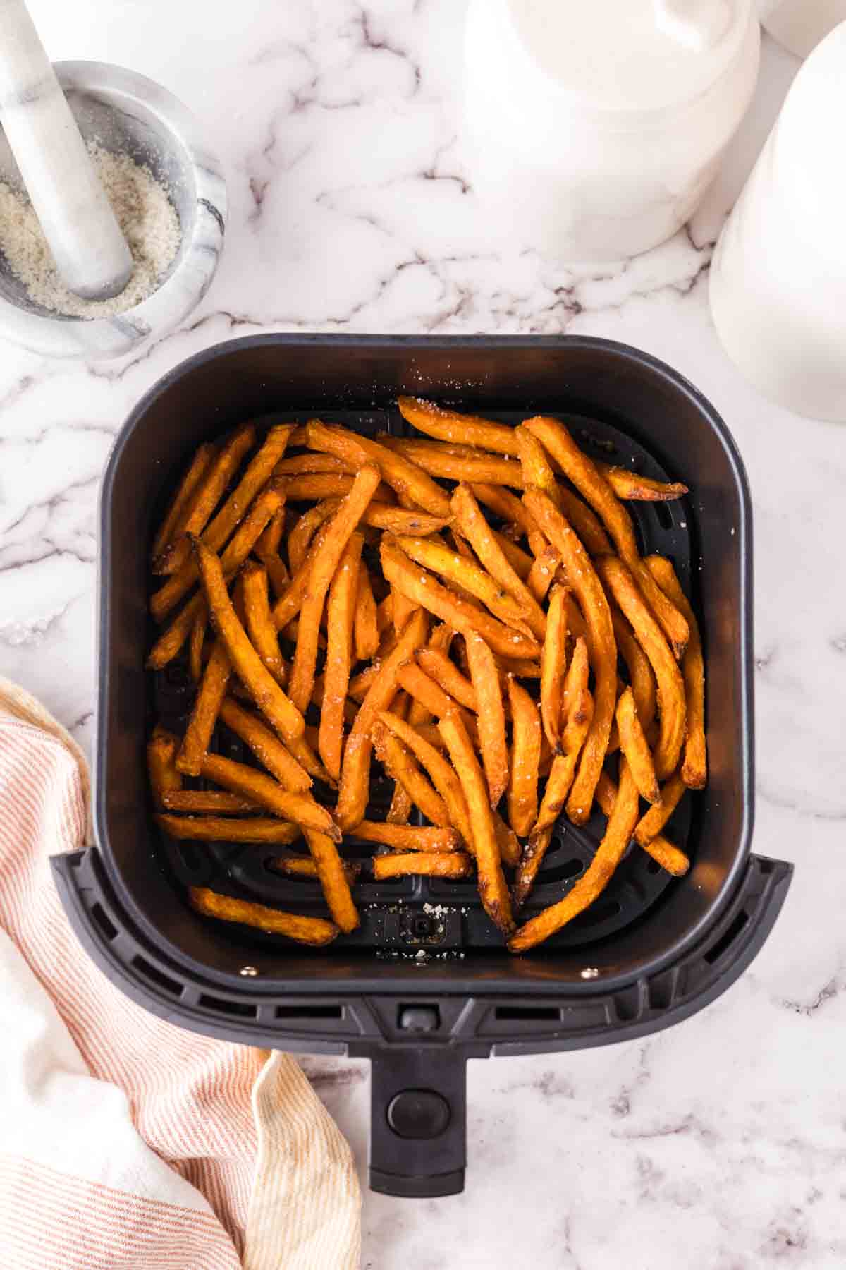 Sweet potato fries in an air fryer.