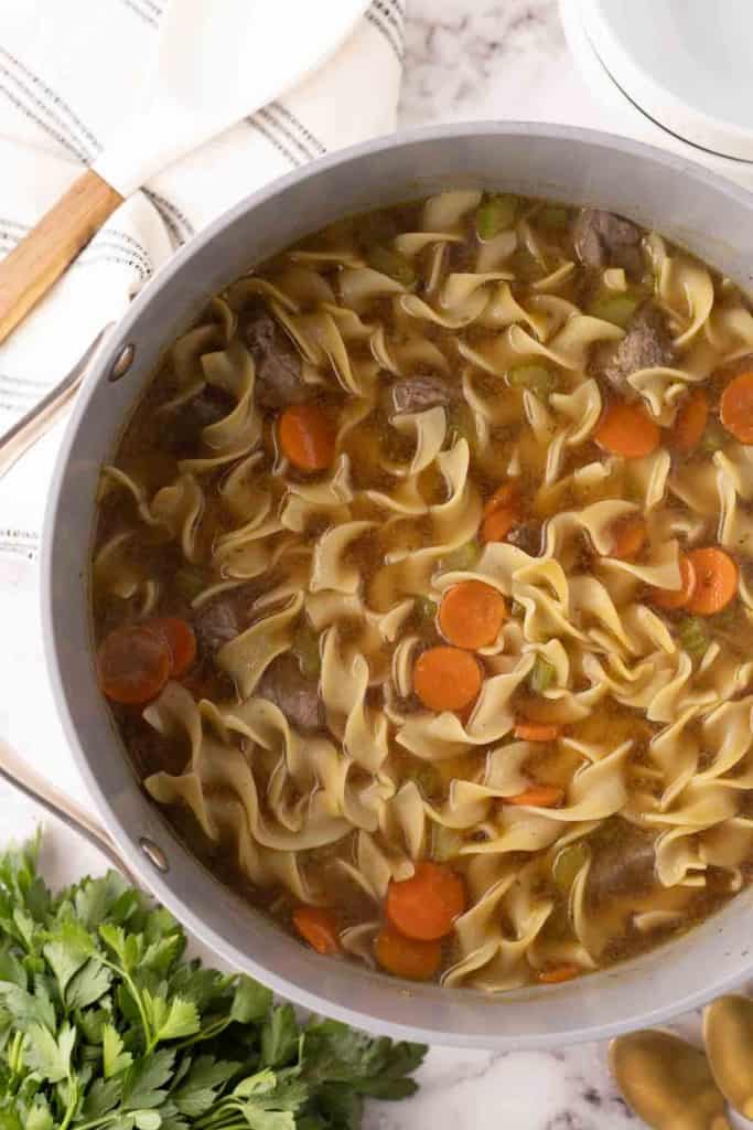 beef noodle soup recipe in a large pot.