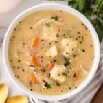 bisquick dumplings recipe in a white bowl with golden spoons.