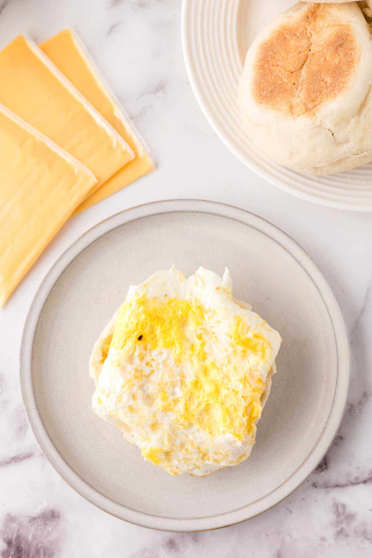 eggs and other ingredients to make a breakfast sandwich.