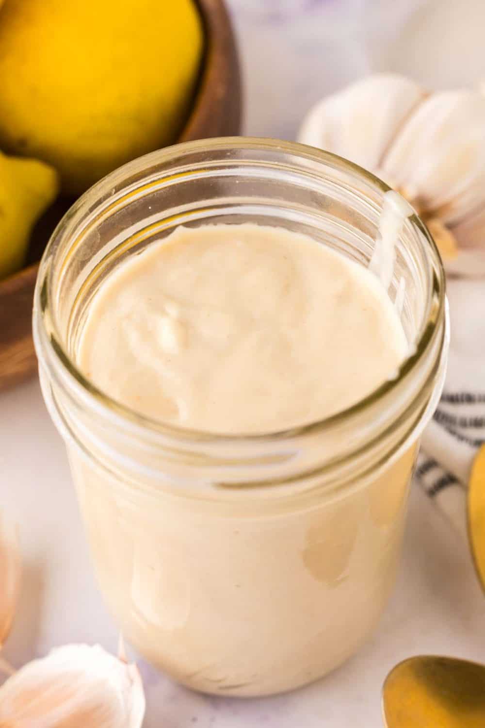 glass mason jar filled with caesar salad dressing