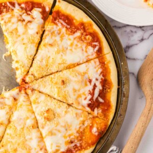 baked cheese pizza recipe on a tray.