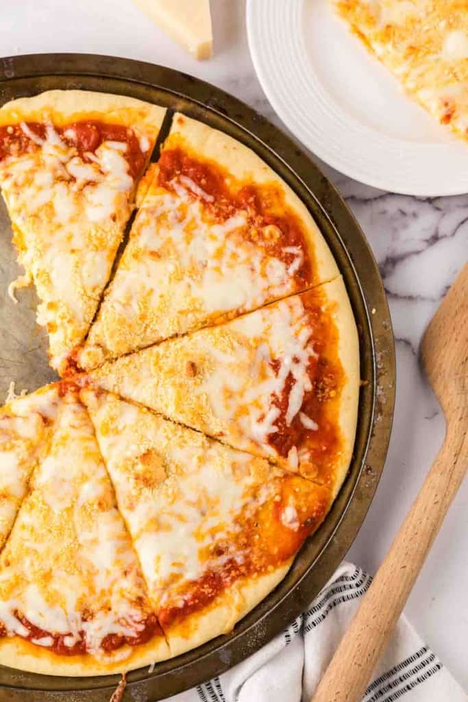 baked cheese pizza recipe on a tray.