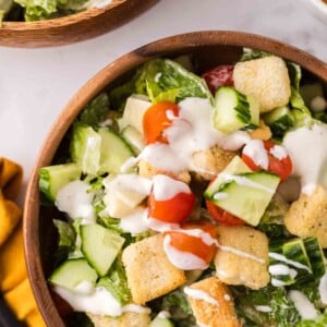 chef's salad in round wooden bowls.