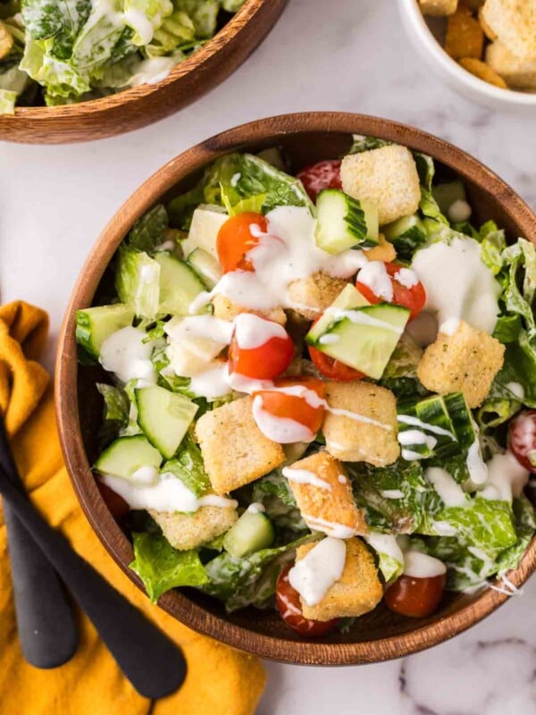 chef's salad in round wooden bowls.