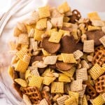 clear mixing bowl the progress of making chex mix recipe.