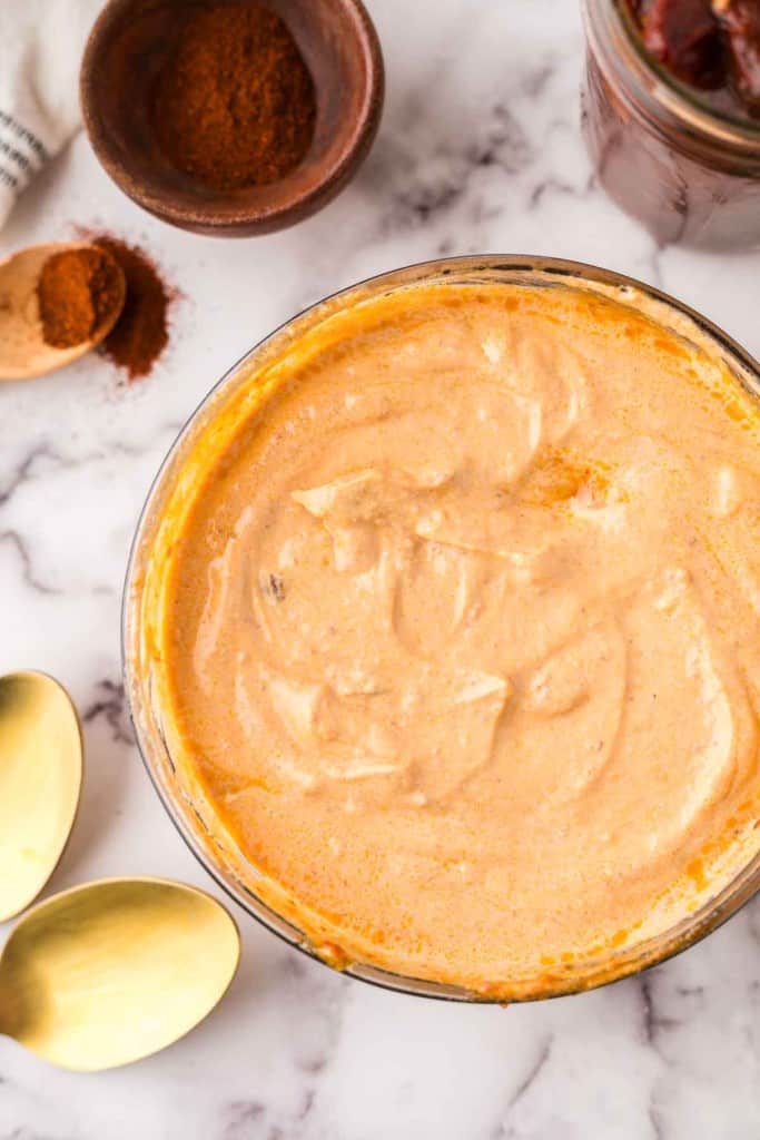 glass mixing bowl of homemade chipotle sauce.