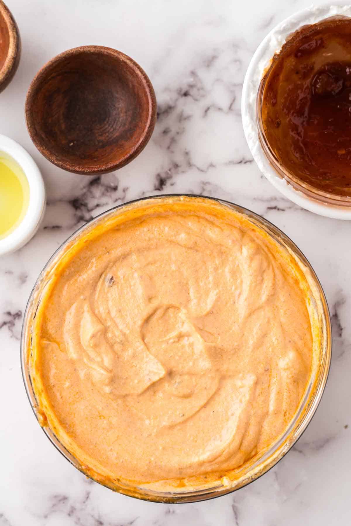 glass mixing bowl of homemade chipotle sauce.