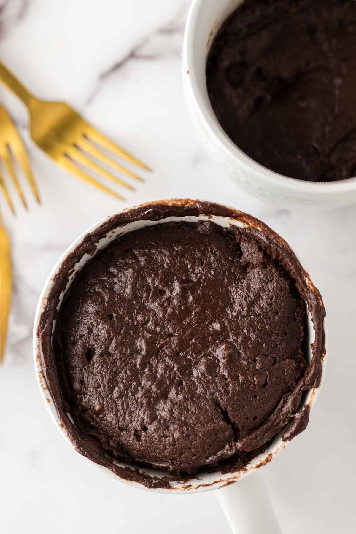 Chocolate cake baked into a white coffee mug.