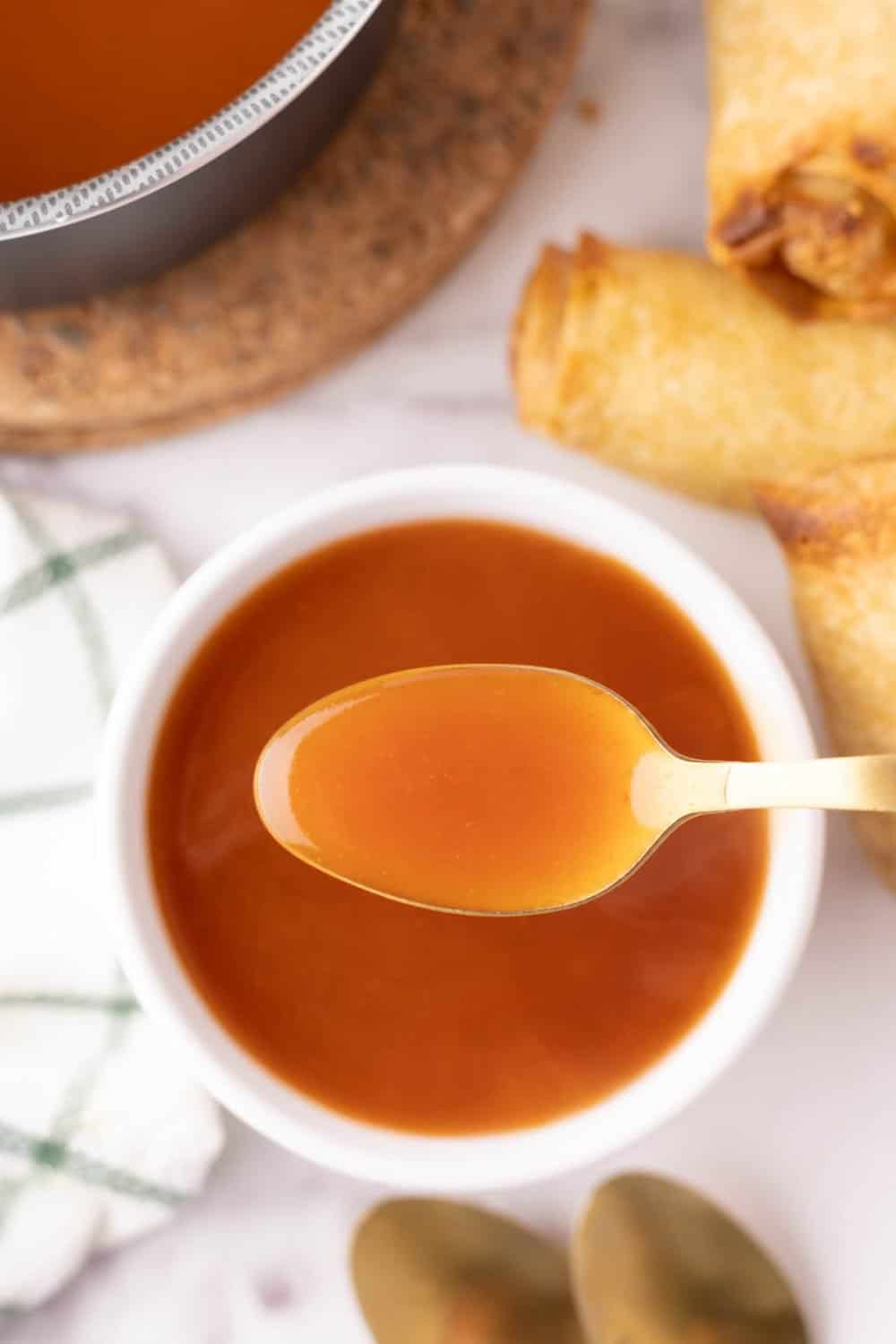 Spoonful of sweet and sour sauce. 