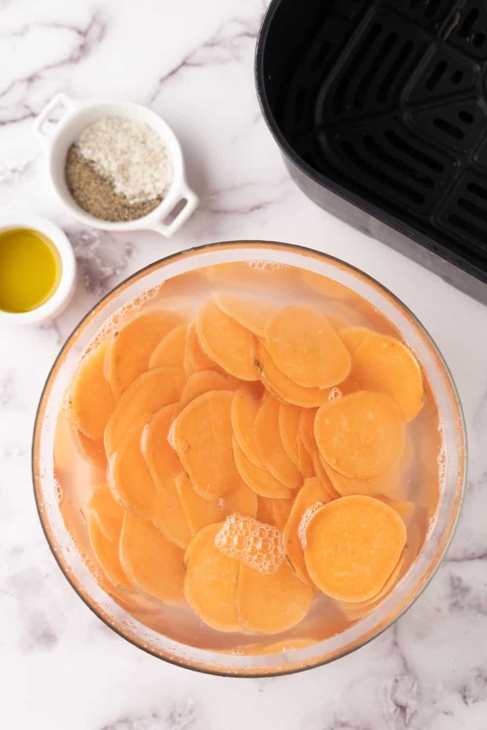 air fryer sweet potato chips in process.