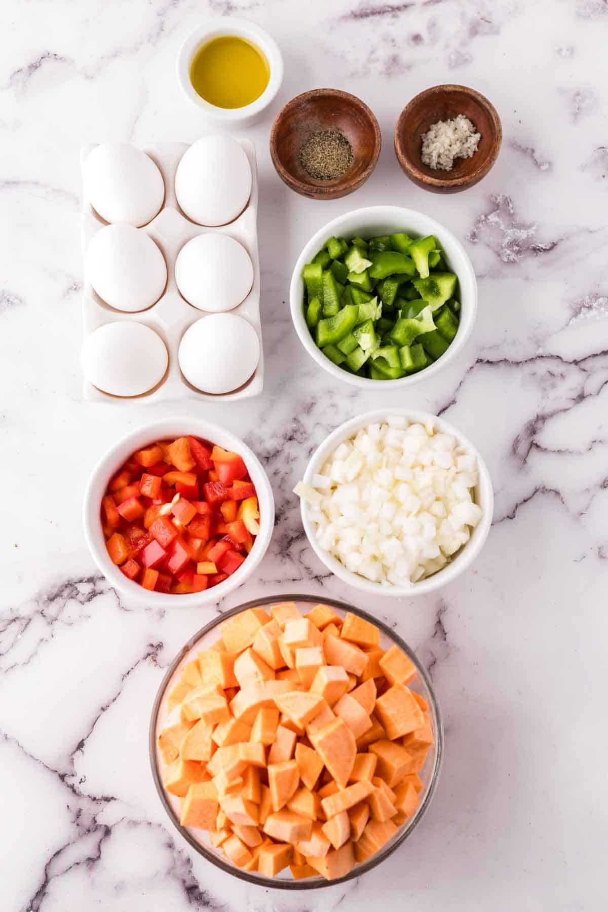 portion bowls each raw ingredient to make sweet potato hash.