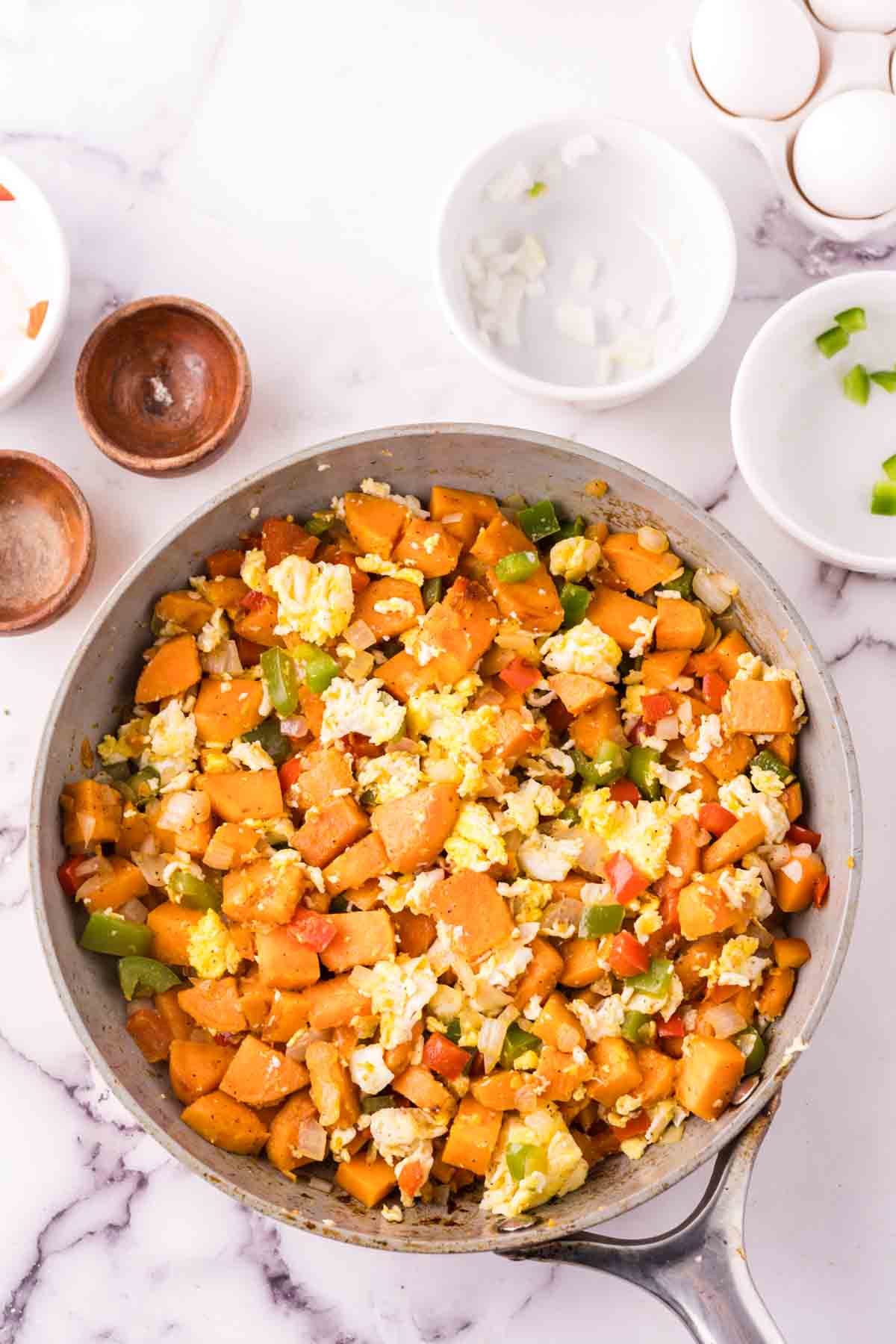 pan of sweet potato hash in progress.