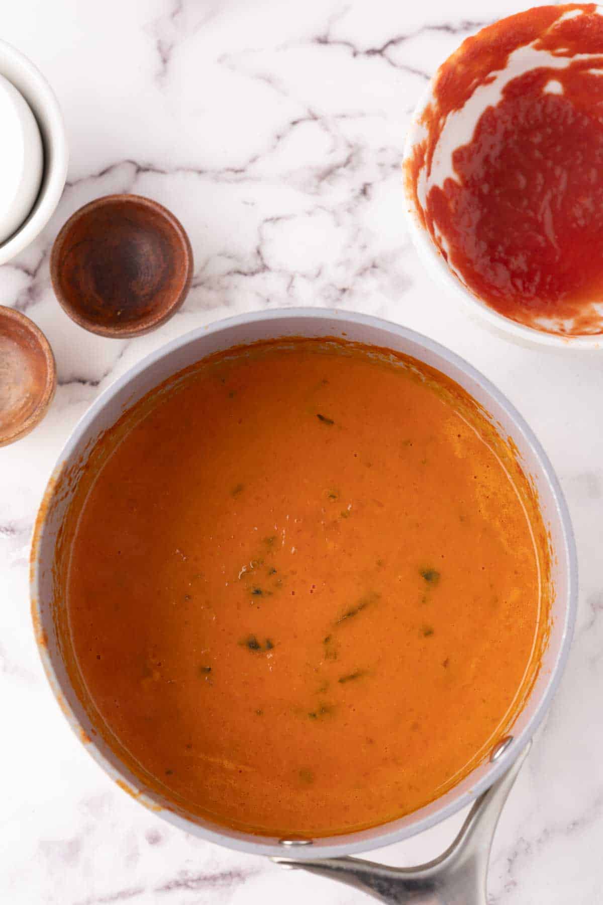 pot of cooking tomato basil soup.