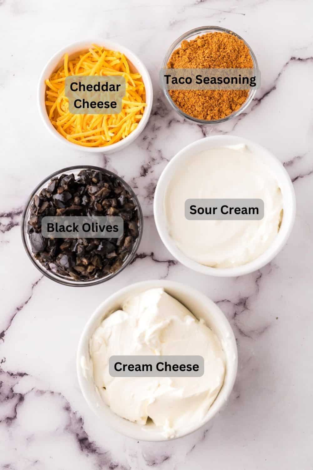 portion bowls with each raw ingredient to make white taco dip recipe.