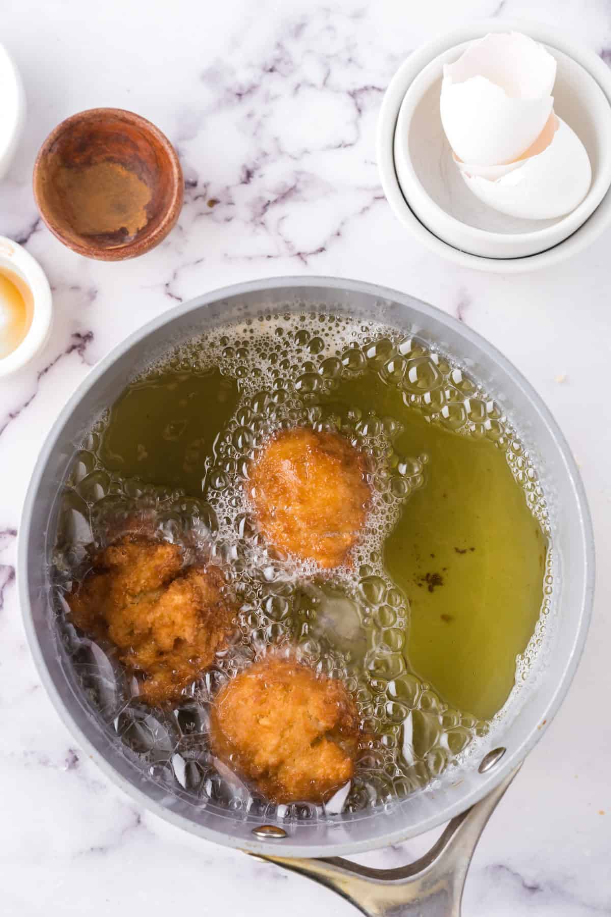 Donuts placed in hot oil.