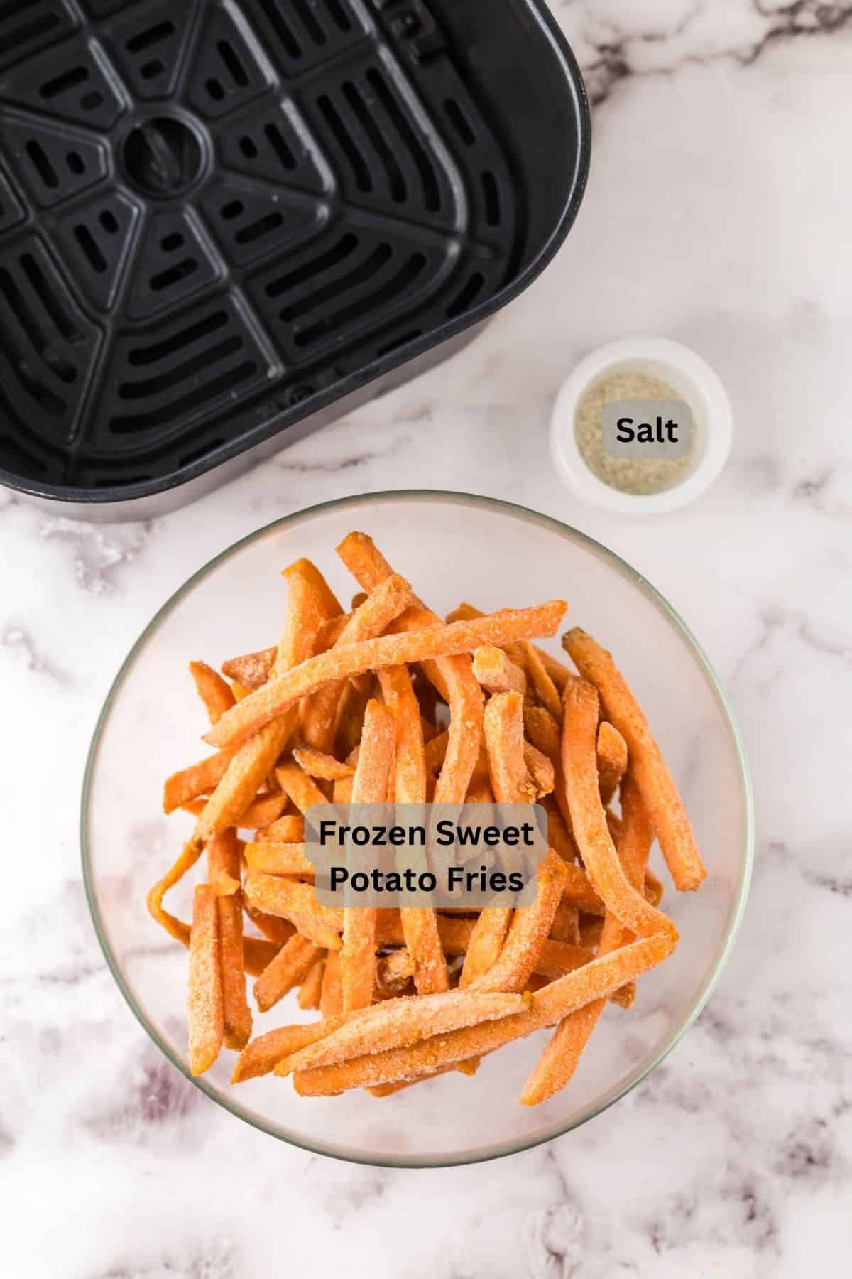 Digitally labeled sweet potato fries and salt in bowls. 
